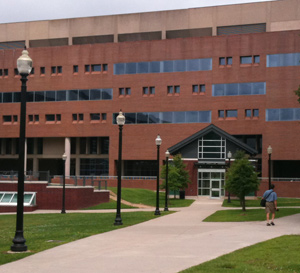Shows the doghouse building with the library in the background.