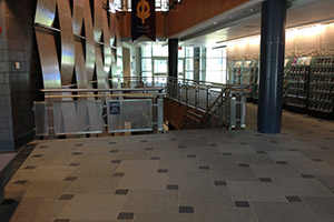 Entering the building you will see stairs that lead downstairs. An elevator is also closeby.