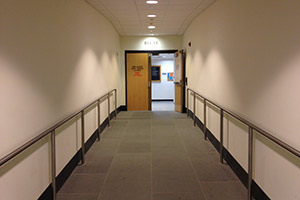 Shows a ramp upwards with doors at the end where you take a left.
